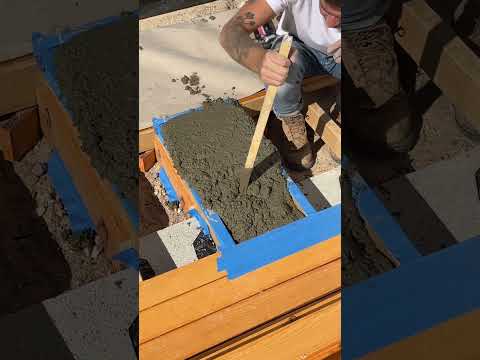 I made some quick and dirty concrete footings for my smart pergola build using the joist as the form